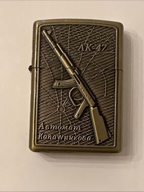 Moma Brass-Tone AK-47 Engraved Flip Lighter